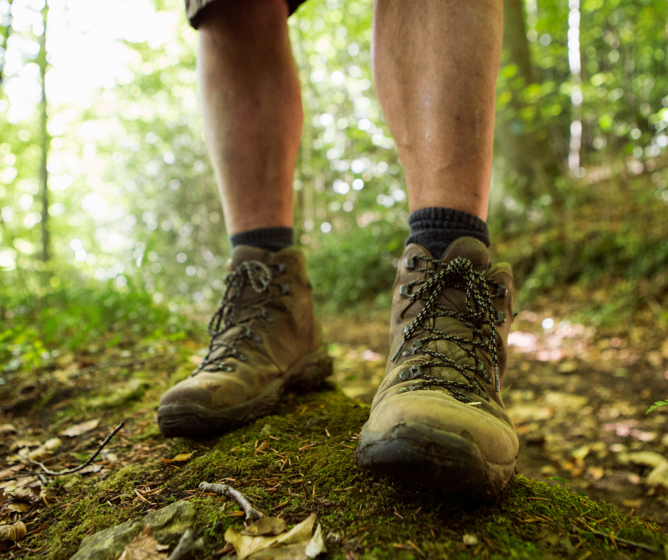 man on trail in hiking boots